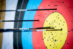 Multiple arrows stuck in an archery target